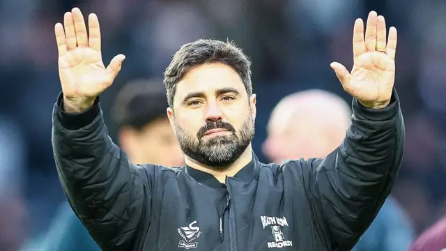 Vitor Matos waves to Swansea's fans after defeat at Derby 