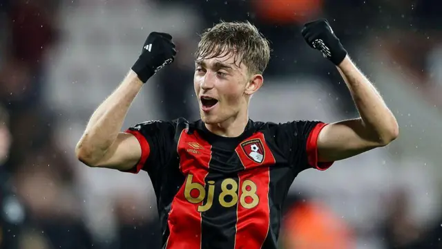 Dean Huijsen celebrating with his fists in the air