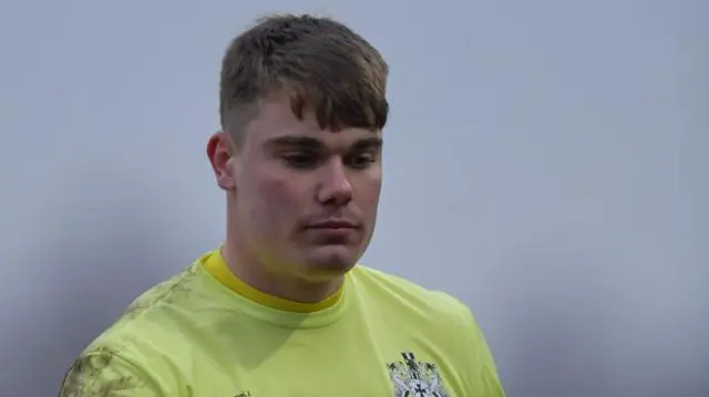 Max Metcalfe stares downwards during his spell on loan at Marine in the Vanarama National League North match against Darlington last February