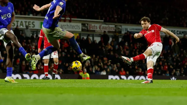 Wrexham midfielder Ollie Rathbone scores