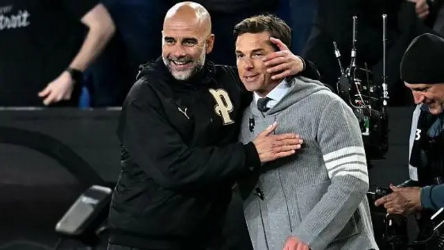 Pep Guardiola reacts with Burnley's English manager Scott Parker