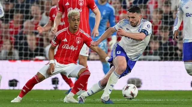 Players compete for the ball as Nottingham Forest take on Aston Villa in the Europa League