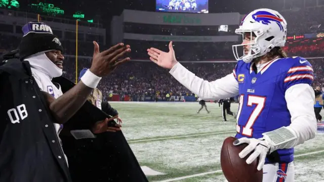 Lamar Jackson shakes hands with Josh Allen after Buffalo beat Baltimore in the 2025 NFL play-offs