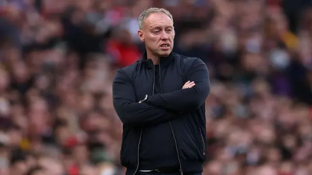 Leicester Head Coach Steve Cooper watches on versus Arsenal