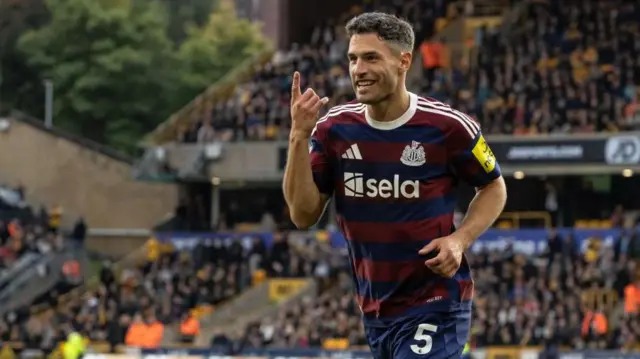 Newcastle United's Fabian Schar celebrates scoring his side's first goal during the Premier League match between Wolverhampton Wanderers FC and Newcastle United FC at Molineux.