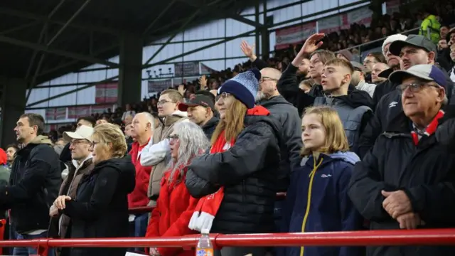 Brentford fans look on watching team against Bournemouth