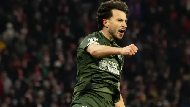 Celtic’s Nicolas Kuhn celebrates after scoring to make it 1-0  during the UEFA Champions League 2024/25 League Knockout Play-off second leg match between FC Bayern Munich and Celtic at the Allianz Arena