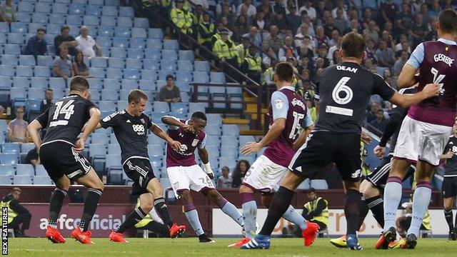 Jonathan Kodjia shoots Aston Villa ahead against Brentford