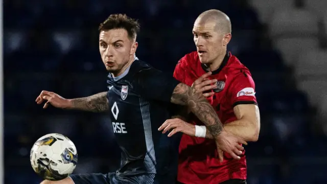 Ross County's Eamonn Brophy and St Mirren's Alex Gogic