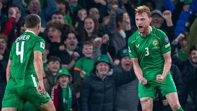 Liam Scales #3 of the Republic of Ireland celebrates with Dara O'Shea #4 of the Republic of Ireland after providing the assist for his sides first goal by Troy Parrott #7 of the Republic of Ireland during the Republic of Ireland V Portugal, 2026 World Cup Qualifying - UEFA, Group Stage match at Aviva Stadium