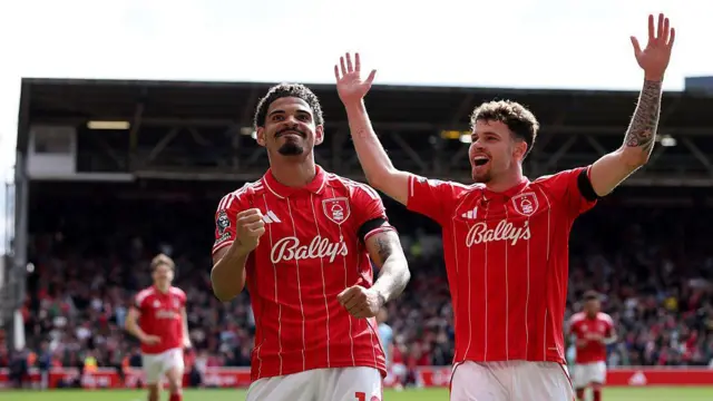 Morgan Gibbs-White celebrates scoring his team's third goal against Burnley with team-mate Neco Williams
