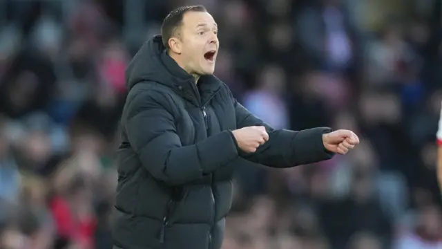 Chris Davies stands on the touchline at St Mary's Stadium 
