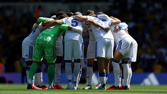 Leeds players in a pre-match huddle