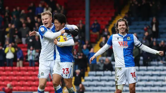 Blackburn Rovers' Yuki Ohashi celebrates scoring his side's second goal against Millwall with Andri Gudjohnsen and Todd Cantwell