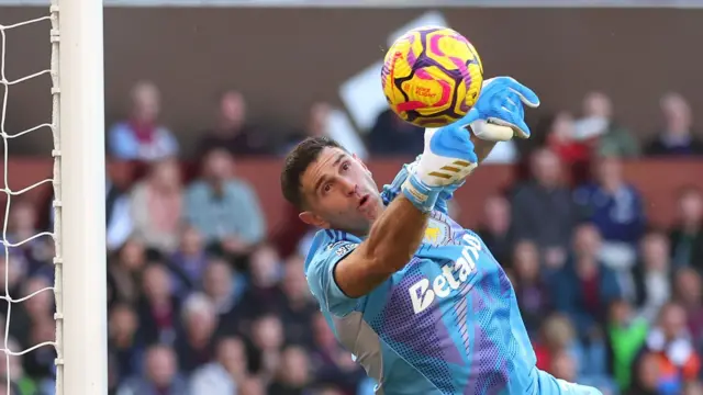 Emiliano Martinez making a save during a match