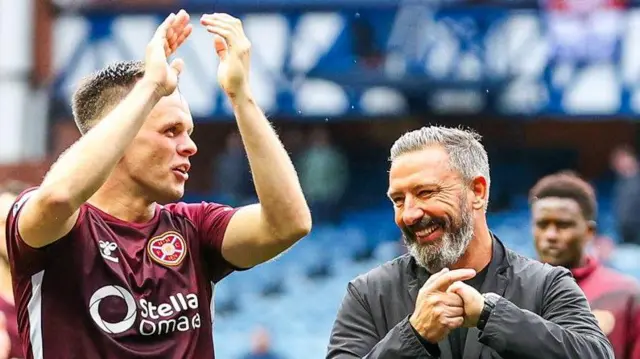 Lawrence Shankland and Derek McInnes celebrate with Hearts