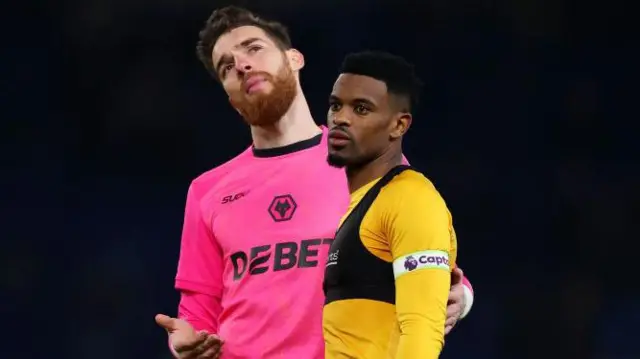 Jose Sa and Nelson Semedo of Wolverhampton Wanderers appear dejected at the end of the Premier League match at Chelsea