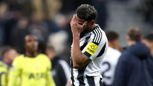 Joelinton with his hand on his head 