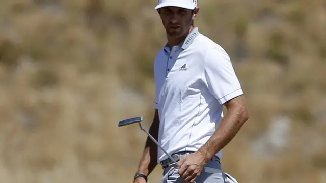 Dustin Johnson with his putter