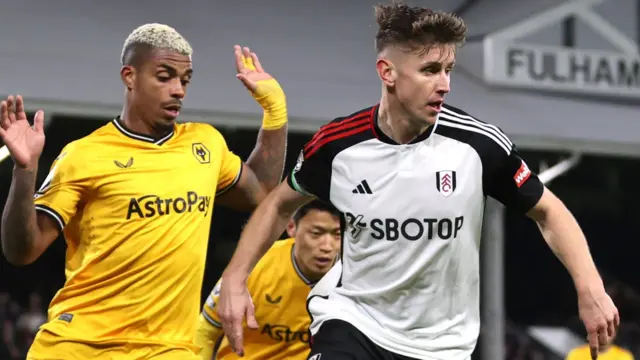 Tom Cairney in action for Fulham against Wolves