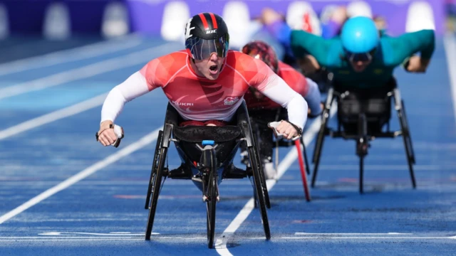 England's Nathan Maguire celebrates winning the T54 1500m at the 2026 Commonwealth Games