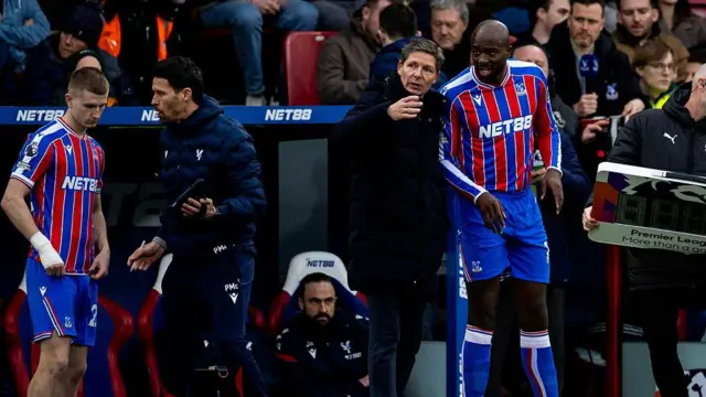Crystal Palace head coach Oliver Glasner gives instructions to Jean Philippe Mateta