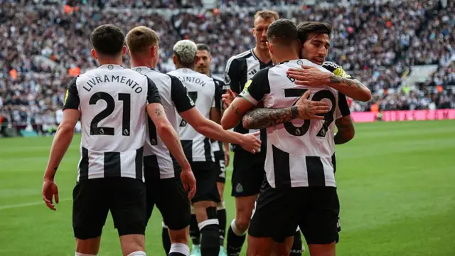 Newcastle players celebrate a goal