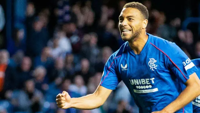 Rangers' Cyriel Dessers celebrates scoring a penalty to make it 2-1 during a William Hill Premiership match between Rangers and Dundee United at Ibrox Stadium