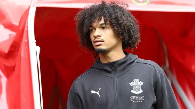 Sekou Mara of Southampton walks out of a stadium tunnel