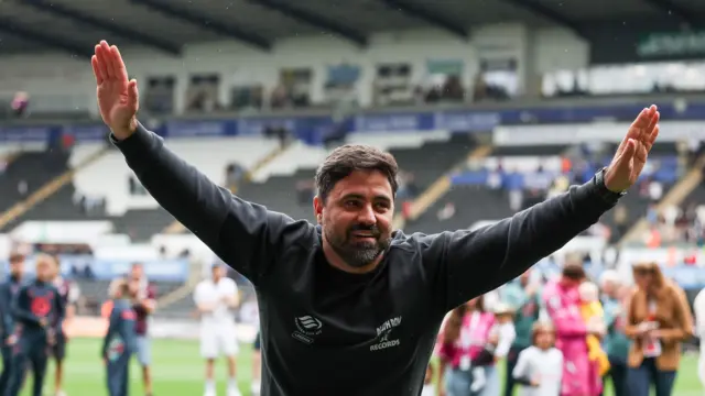 Swansea boss Vitor Matos celebrating with supporters after a final day 3-1 win against Charlton in May