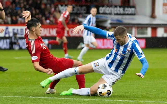 Kilmarnock's Liam Polworth (R) and Aberdeen's Jamie McGrath in action 