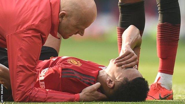 Manchester United midfielder Jesse Lingard down injured