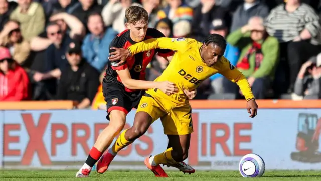 Dean Huijsen battles with Jean-Ricner Bellegarde 