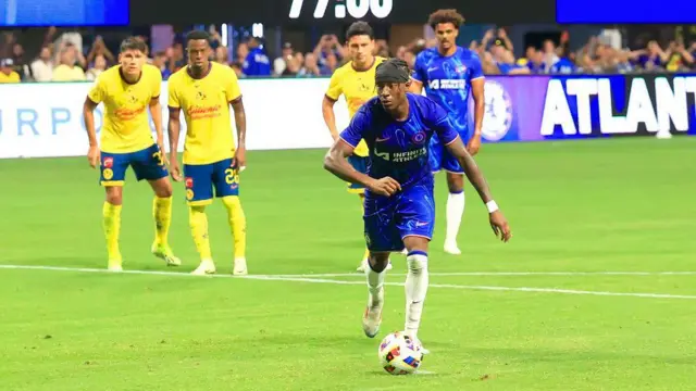 Noni Madueke takes a penalty for Chelsea