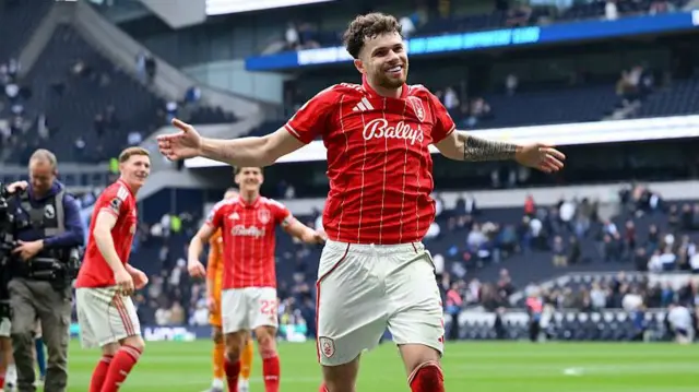 Neco Williams celebrates after scoring at Tottenham Hotspur Stadium