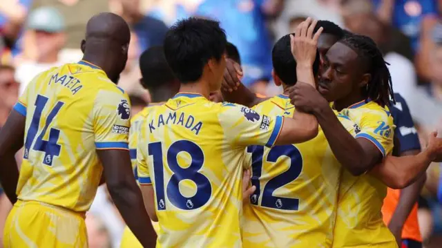 Crystal Palace players celebrate Eze's equaliser at Chelsea