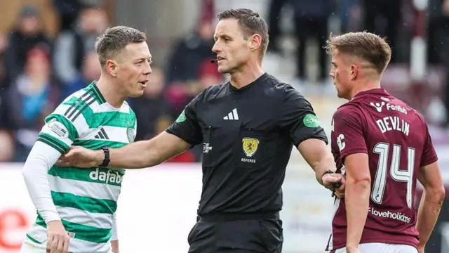 Callum McGregor squares up to Hearts' Cammy Devlin