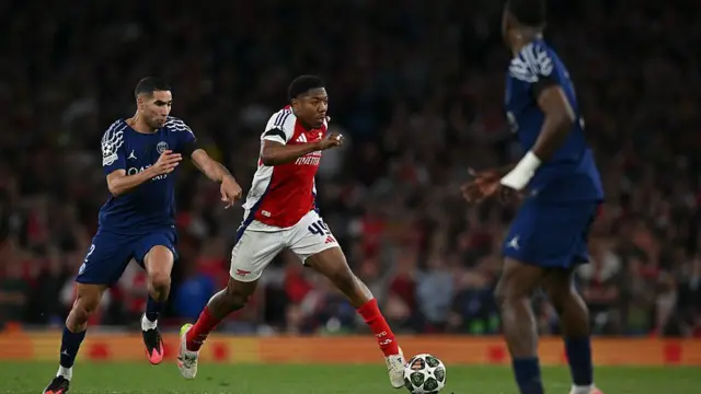 Myles Lewis-Skelly in action against Paris St-Germain
