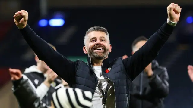 Stephen Robinson celebrates