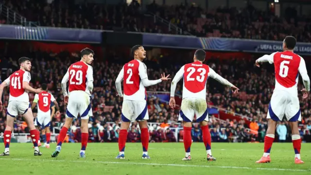 William Saliba of Arsenal shouts instructions to his team mates as they line up to defend a set-piece