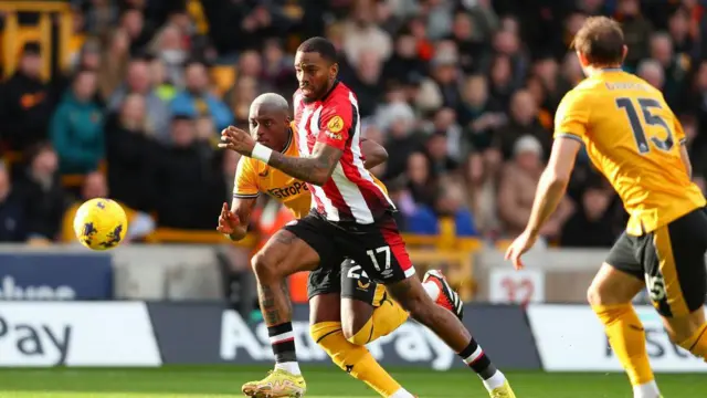 Ivan Toney of Brentford, wearing number 17, is playing in the Premier League match between Wolverhampton Wanderers and Brentford