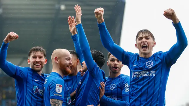 Portsmouth players celebrate Andre Dozzell's opening goal against Oxford United