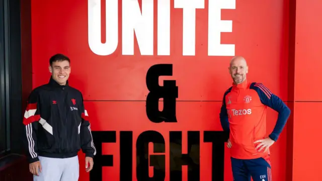 Manuel Ugarte of Manchester United poses with Manager Erik ten Hag after signing for the club at Carrington Training Ground on August 30, 2024