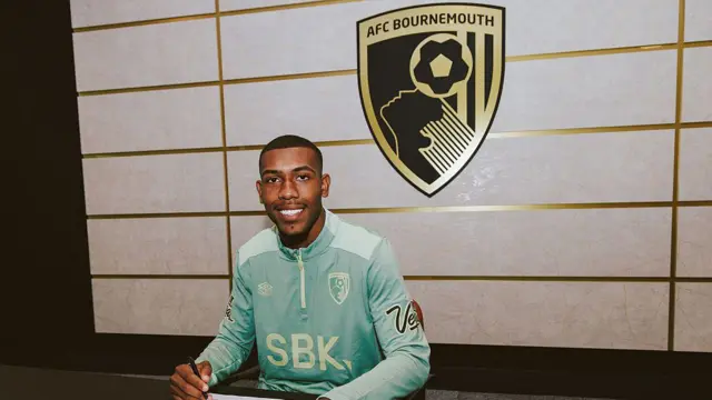 Rayan signing his AFC Bournemouth contract 