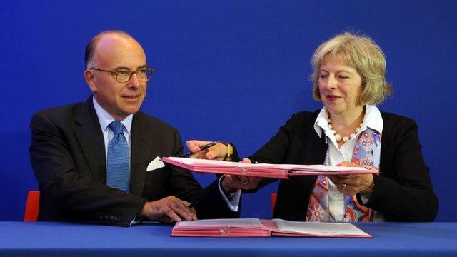 Theresa May and French Interior Minister Bernard Cazeneuve