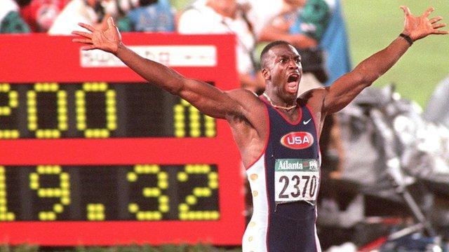 Michael Johnson celebrates breaking the 400m World Record