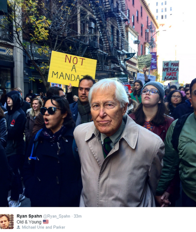 Tweeted image, protesters fill a street, with anti-Trump placards