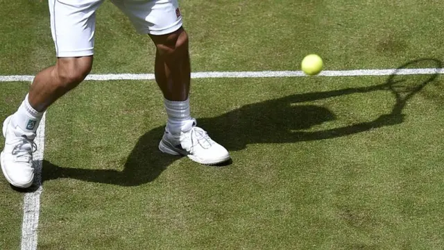 Tennis player's shadow