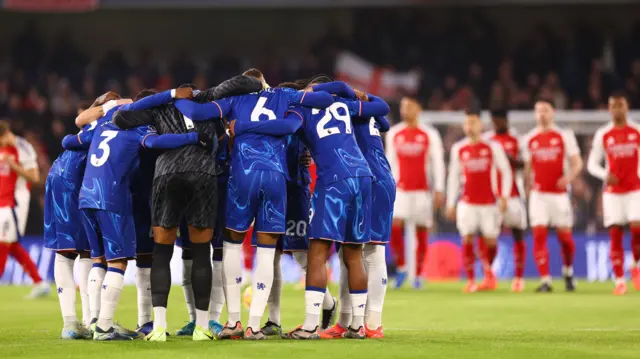 The Chelsea squad huddle during the Premier League match between Chelsea FC and Arsenal FC at Stamford Bridge