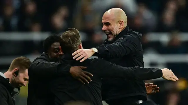 Manchester City Head Coach Pep Guardiola celebrates after Manchester City score third goal